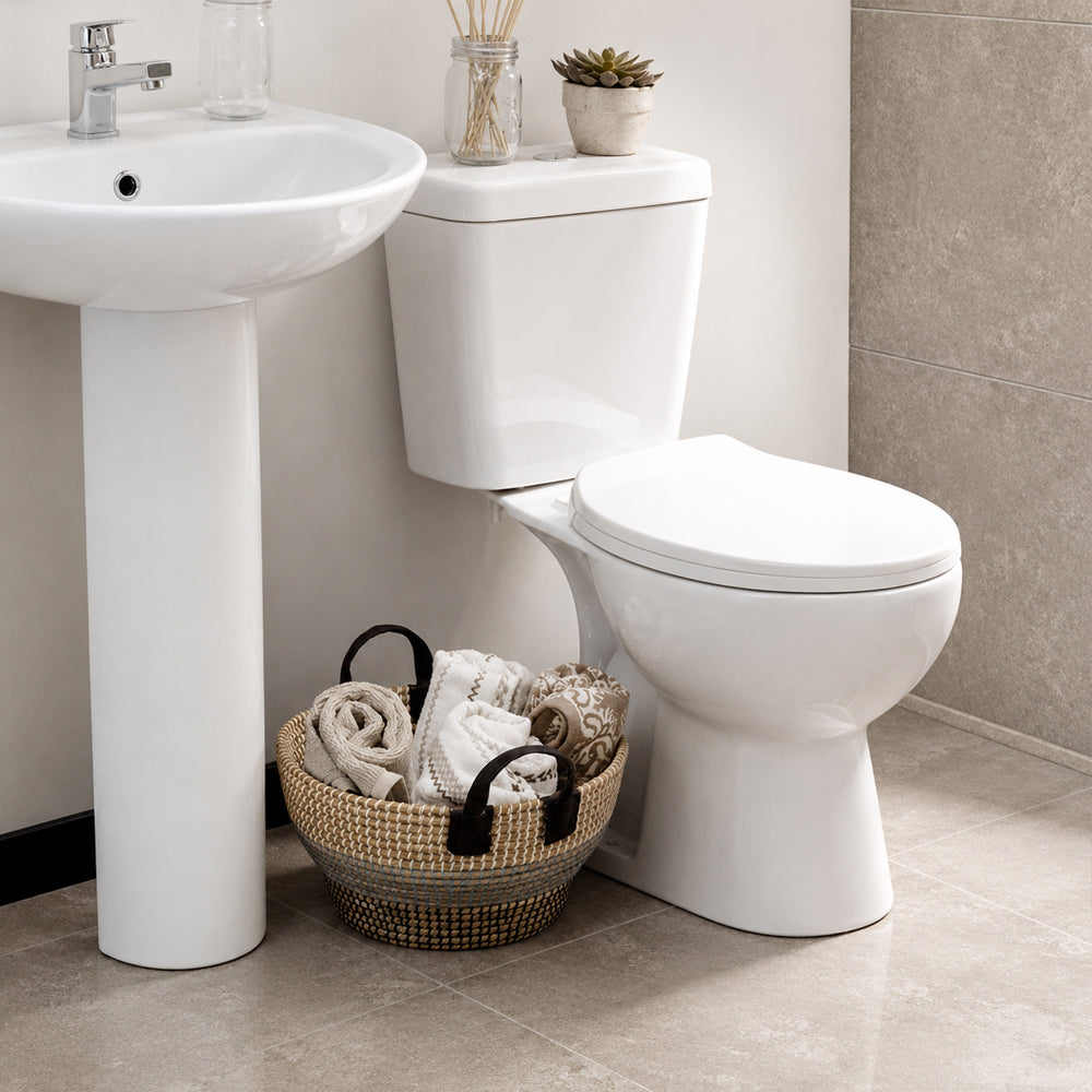Taza WC Aura Salida Vertical con fijaciones y Manguito a piso